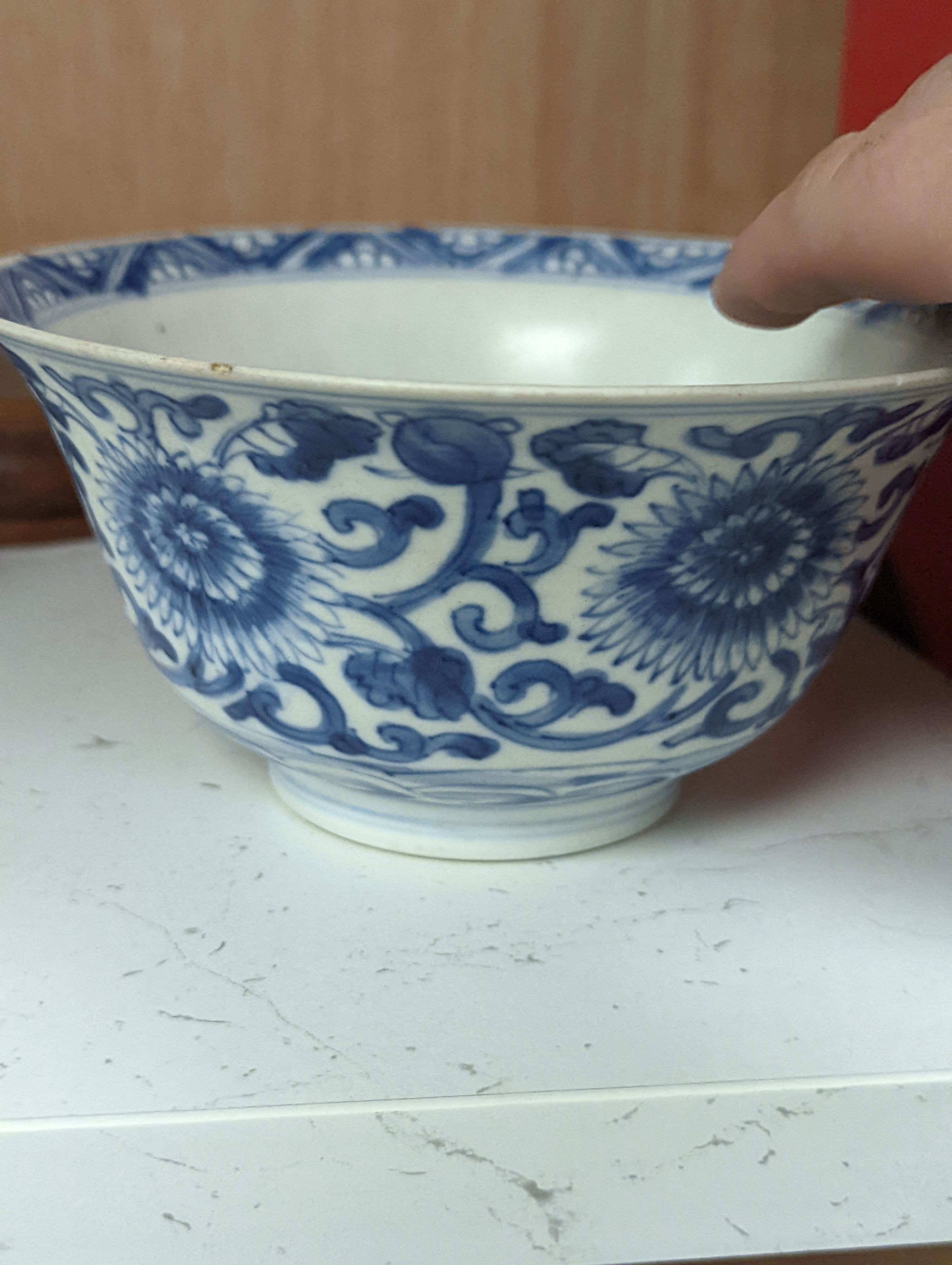 A Chinese blue and white bowl, Kangxi, 15cm. diam., a famille rose teapot stand, Yongzheng, and two doucai bowls